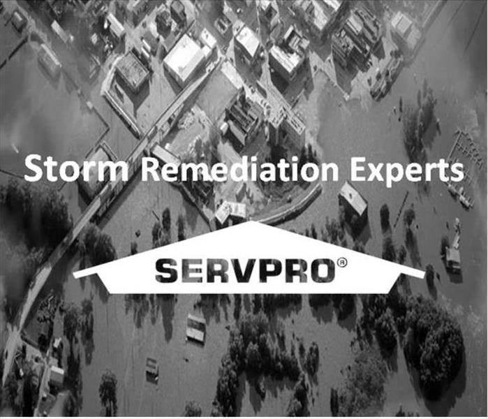 Image of flooded town with SERVPRO Logo and text, Storm Remediation Experts
