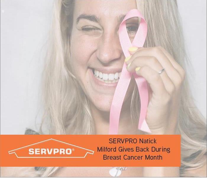 Lady with Pink Ribbon with orange text box and SERVPRO logo 